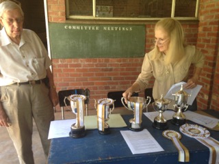 Roy Ellis and Geraldine McLaughlan showing the various trophies which were presented to the winners.